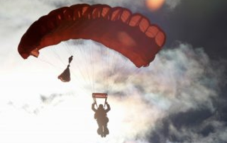 Person gliding on a Parachute